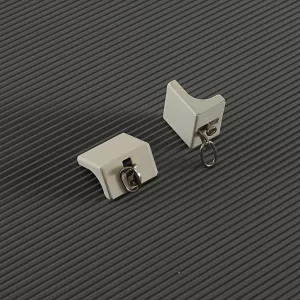 Terminal para Riel Hotelero con tornillo, ideal para sellar extremos del riel y evitar deslizamientos indeseados